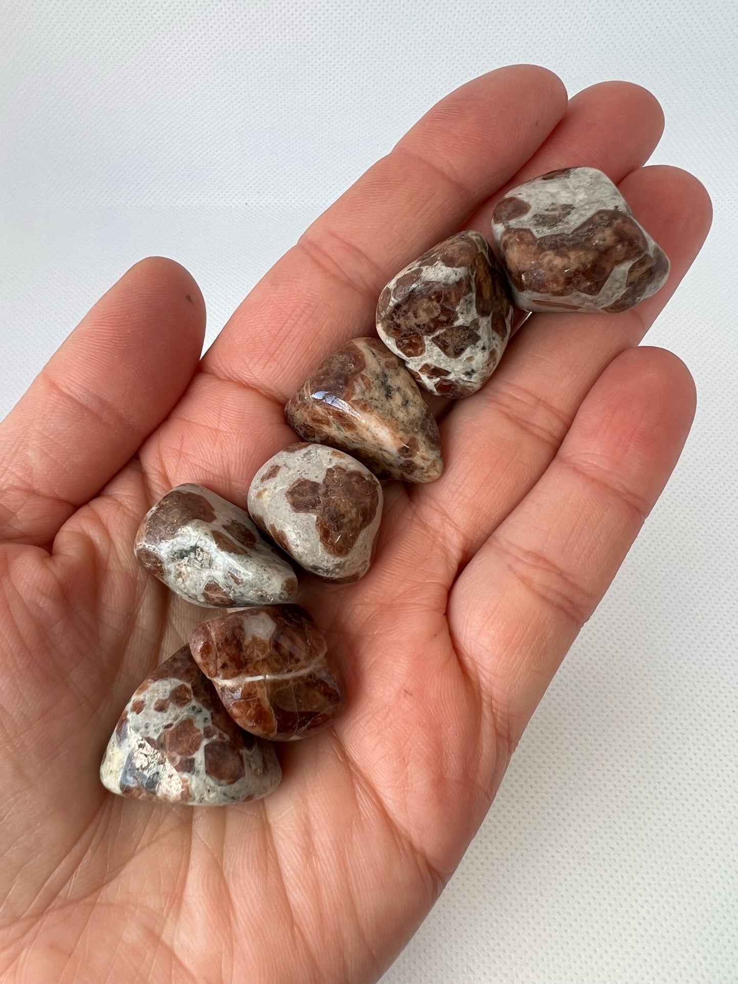 Spessartine Garnet in Limestone Tumbled Stone